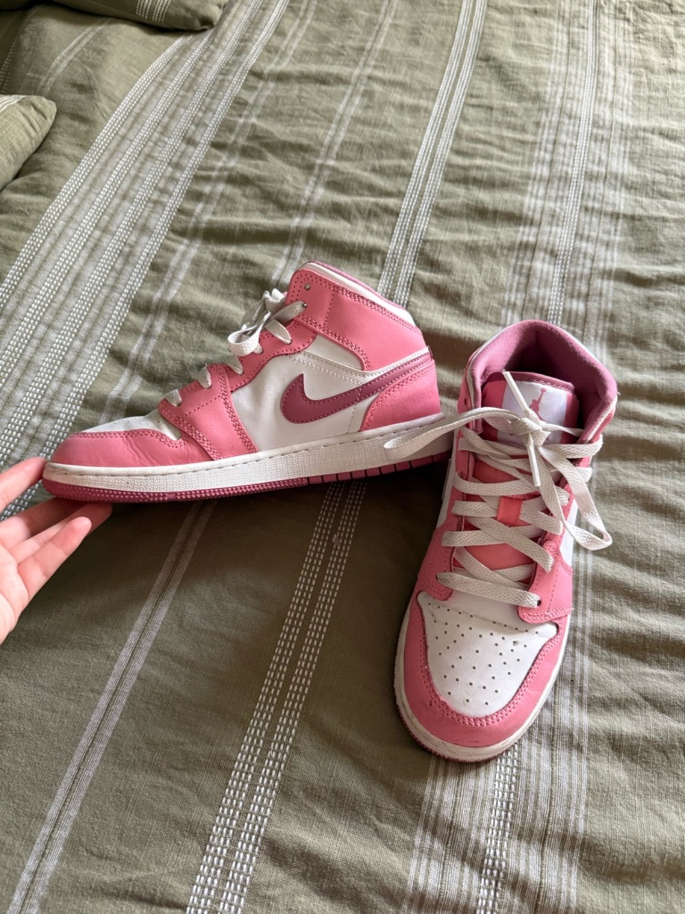 Pink and white Nike shoes